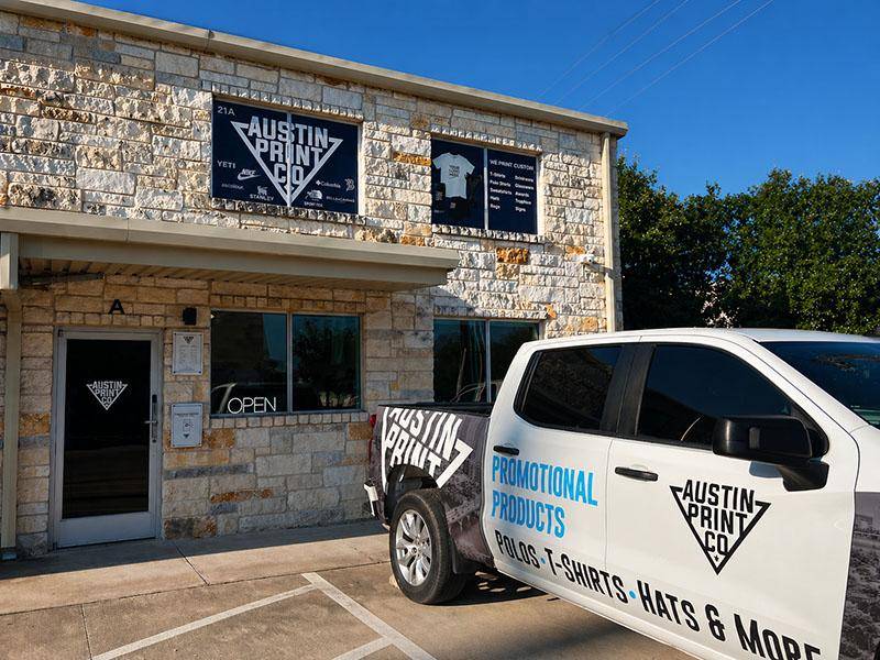 Austin Print Co shop exterior with branded truck